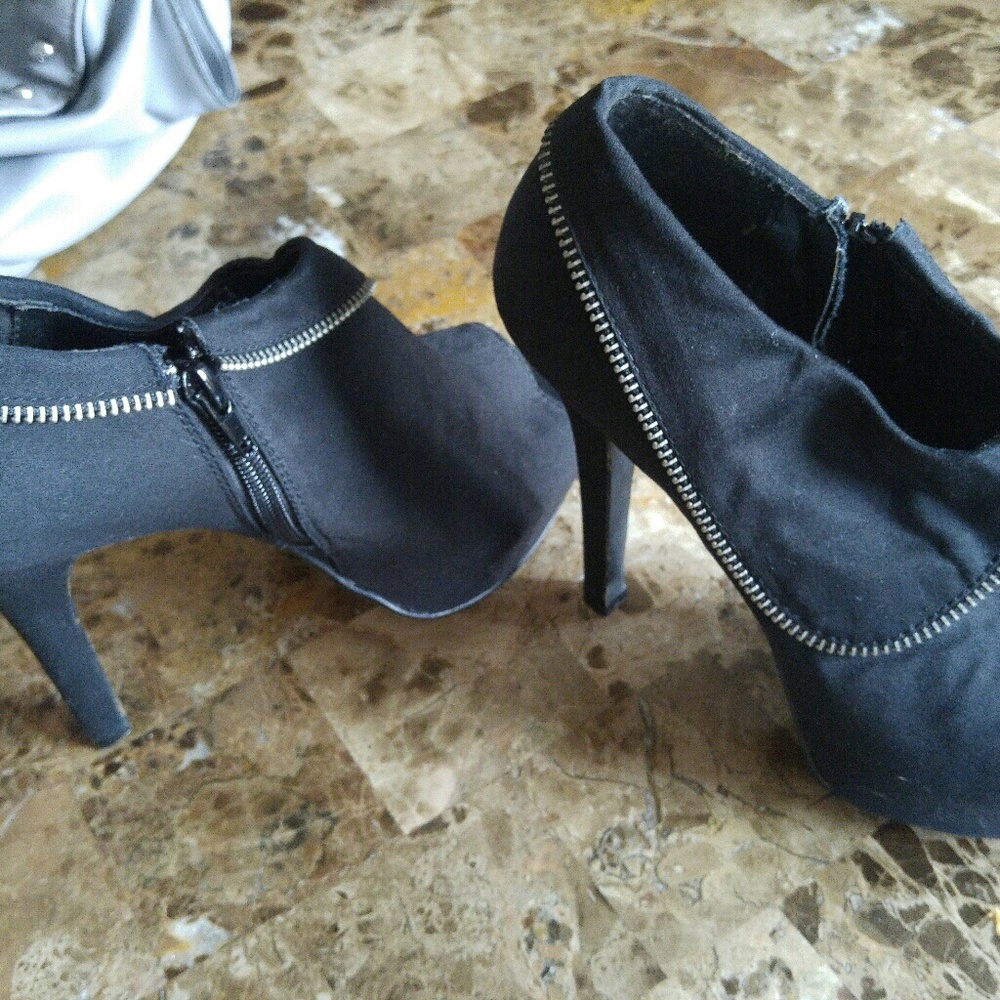 Black heels with zipper by Charlotte Russe
